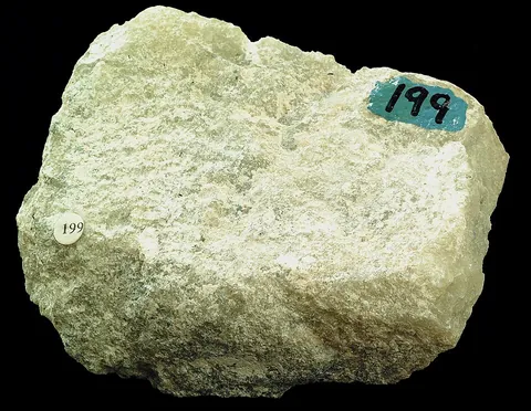 soapstone: a soft rock, rich in talc, also containing serpentine and either magnetite, dolomite or calcite