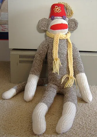 sock monkey: a soft toy made from socks fashioned in the likeness of a monkey
