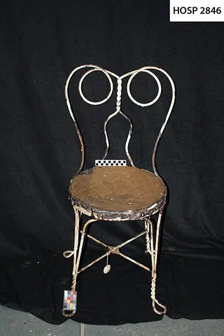 soda fountain chair: a chair of the kind that patrons might occupy at a soda fountain counter, typically having a round...