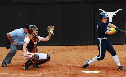 softball: a game similar to baseball but played with a larger and softer ball which can be thrown overhand or...