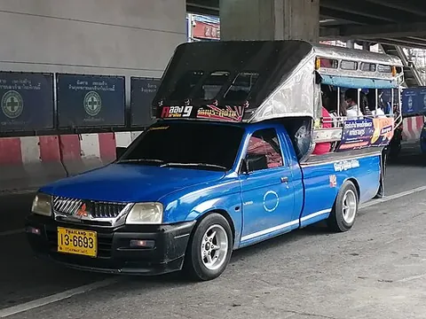 songthaew: a pickup truck converted into a shared taxi by the addition of a bench or row of seats along each...