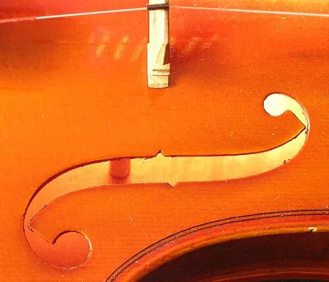 sound post: a wooden rod located inside the body of a violin-family instrument, close to the treble-side bridge...