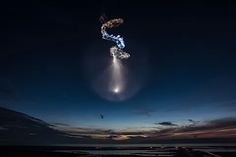 space jellyfish: an atmospheric phenomenon of the early morning or late evening, where the ground is in nighttime,...