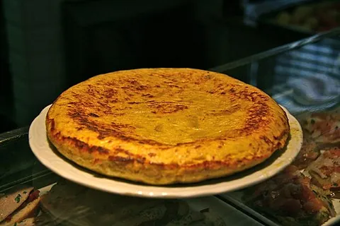spanish omelette: a molded omelette made with the addition of fried potatoes and often onions