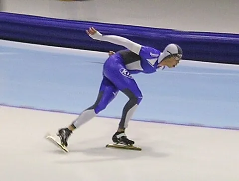 speed skating: the sport of racing around an oval course, on ice skates