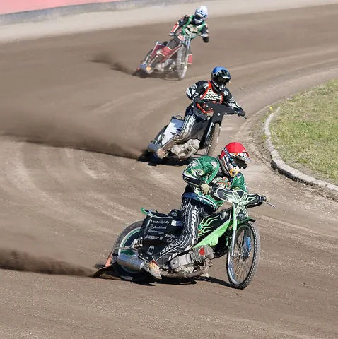 speedway: a form of motorcycle racing on flat (without camber) oval dirt tracks using motorcycles with...