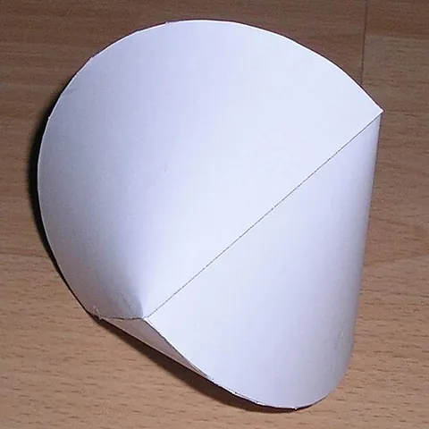 sphericon: a solid constructed by slicing a bicone with 90-degree apices through a plane containing both of...