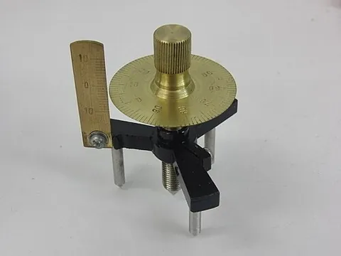 spherometer: a device used to measure the curvature of a surface, such as a lens