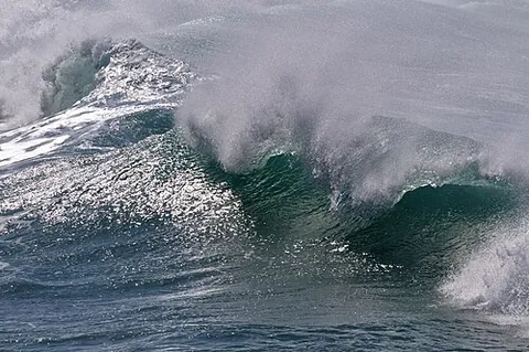 spindrift: sea spray (clouds of water droplets) blown from the tops of waves by the wind and whipped along the...
