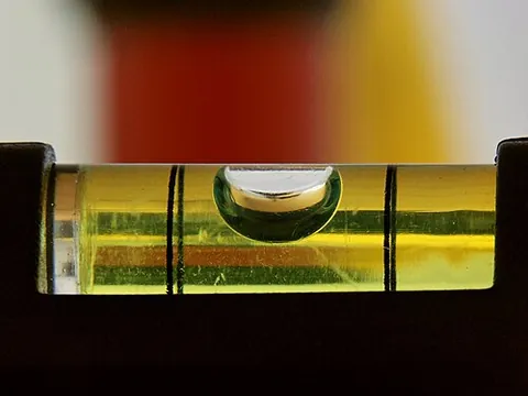 spirit level: a tool employing a chamber with a colored liquid (usually alcohol, hence spirit) and an air bubble,...