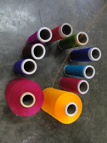 spool: a reel; a device around which thread, wire or cable is wound, especially a cylinder or spindle