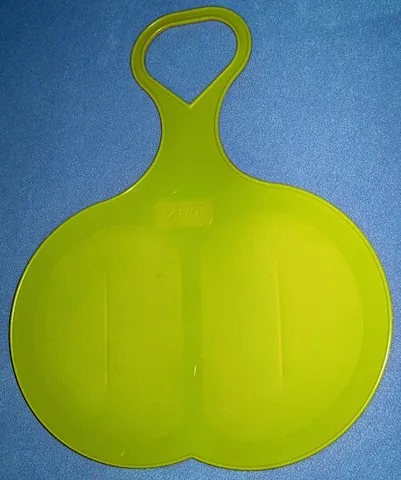 spoon sled: a type of sled consisting of a sheet of material to cup one's butt and a handle sticking out in...
