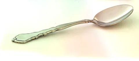 spoon: an implement for eating or serving; a scooped utensil whose long handle is straight, in contrast to...