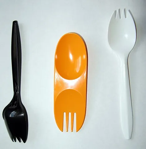 spork: an eating utensil shaped like a spoon, the bowl of which is divided into tines like those of a...