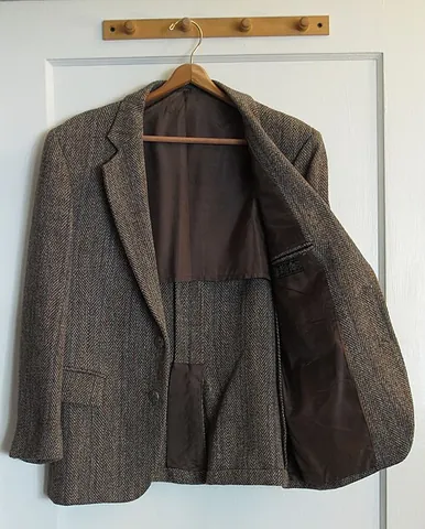 sports jacket: a tailored jacket that is not part of a suit; especially one of a sturdy fabric originally designed...