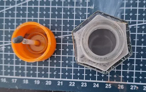 sprue goo: sludge made from pieces of plastic sprue melted in plastic cement; used for filling small gaps in...
