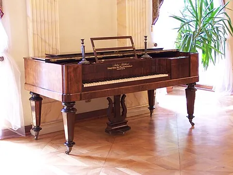 square piano: a piano with a horizontal frame and an oblong case