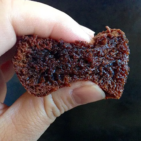 squish: to squeeze, compress, or crush (especially something moist)