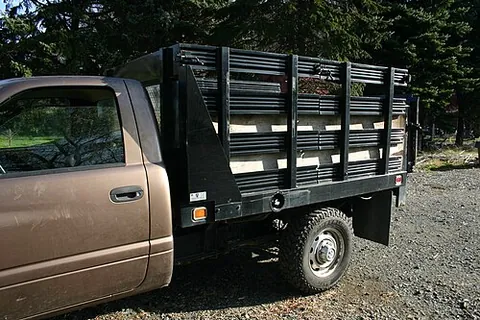 stakebody: a type of truck body or wagon body composed of stakes, often easily removable from the bed, such...
