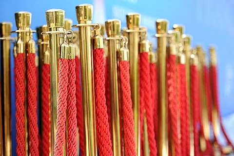 stanchion: a vertical pole, post, or support