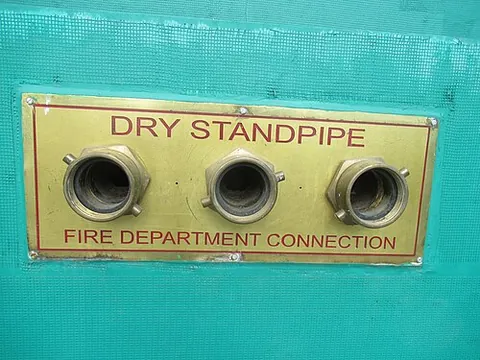 standpipe: a vertical pipe into which water is pumped so that a desired pressure is available at the bottom