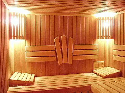 steam room: a sauna; a hot room that is filled with steam in which people sit for health reasons