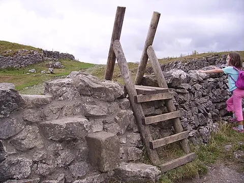 stile: a set of one or more steps surmounting a fence or wall, or a narrow gate or contrived passage...