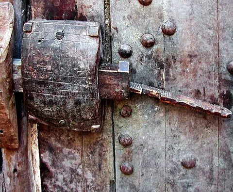 stock lock: a lock enclosed in a wooden case and attached to the face of a door