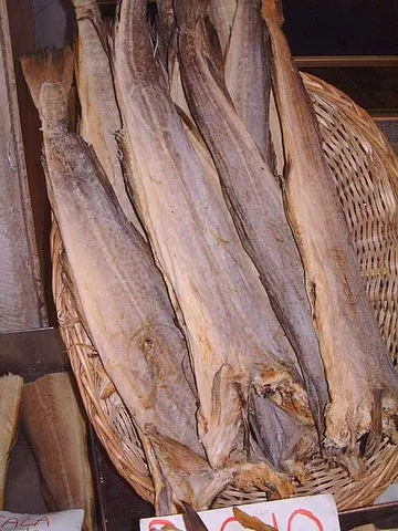 stockfish: cod (or similar fish) having been cut open and cured in the open air without salt