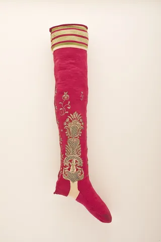 stocking: a soft garment, usually knit or woven, worn on the foot and lower leg under shoes or other footwear