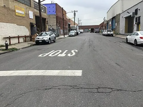 stop bar: a transverse road marking indicating the point at which a vehicle must stop