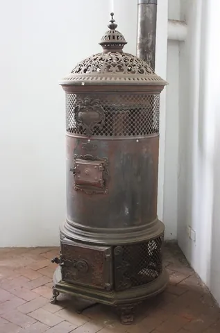 stove: a heater, a closed apparatus to burn fuel for the warming of a room