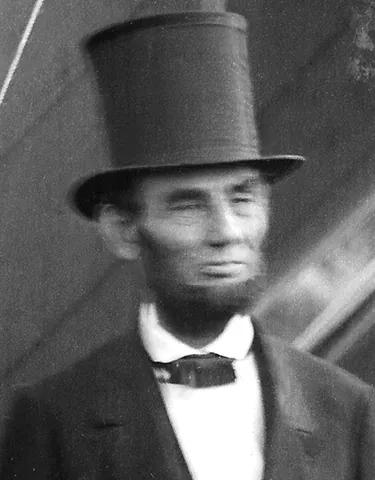 stovepipe hat: a type of top hat worn mainly in the 19th century, made of silk or other materials and having a...