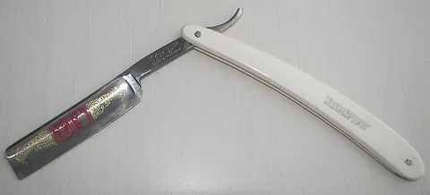straight razor: a razor of a plain and traditional type with no feature that would limit the depth of exposure to...