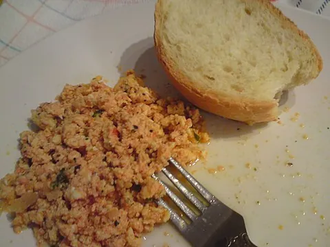 strapatsada: a Greek dish of tomatoes fried with olive oil, pepper, and beaten eggs