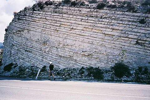 stratum: one of several parallel horizontal layers of material arranged one on top of another
