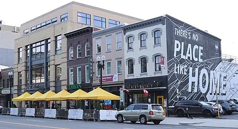 streatery: an on-street outdoor dining establishment, frequently under a tent, umbrella, or awning with heaters