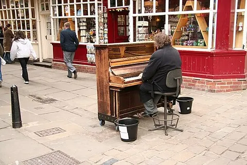 street piano: a piano placed in a public area to encourage passers-by to stop and play