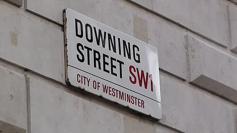 street sign: a sign showing the name of a street, usually placed at a street corner