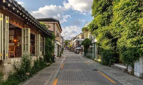 street: a paved part of road, usually in a village or a town