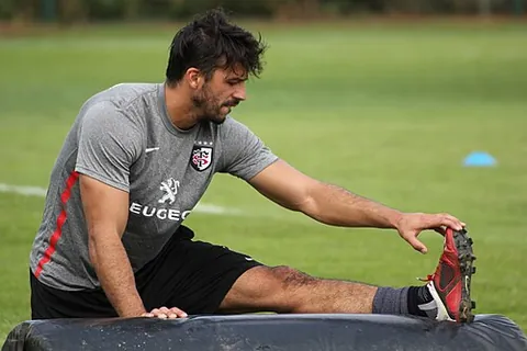stretching: the act by which something is stretched