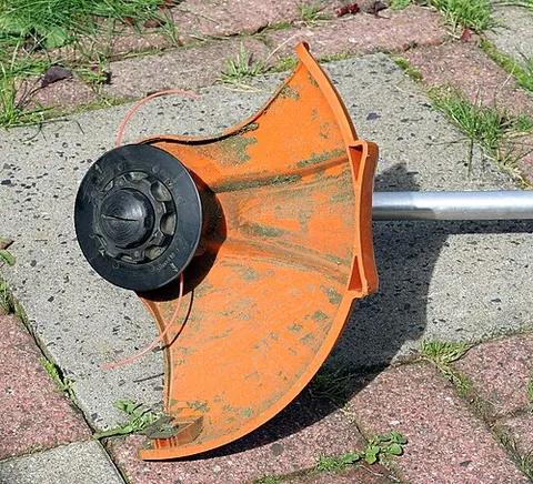 string trimmer: a powered, hand-held garden implement that uses a rotating monofilament line to cut grass, etc.,...