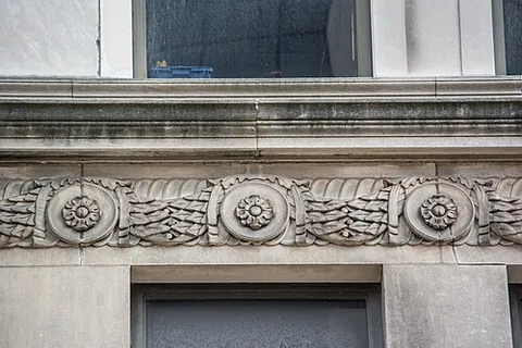 stringcourse: a thin projecting course of brickwork or stone that runs horizontally around a building, typically...