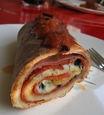 stromboli: a type of turnover filled with various cheeses, typically mozzarella, and Italian meats such as...
