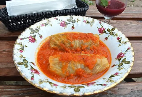 stuffed cabbage: parboiled cabbage leaves (or a hollowed-out head) filled with a savory mixture of minced meat (like...