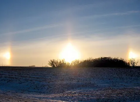 sun dog: a bright spot in the sky, usually one of two on a parhelic circle on both sides of the sun (or...
