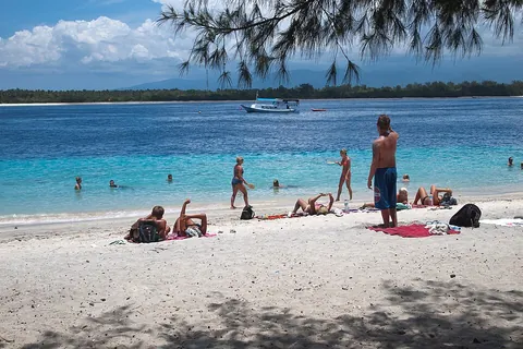 sunbathe: to expose one's body to the sun in order to relax or to obtain a suntan; to take the sun