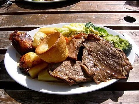 sunday roast: a traditional roast dinner, eaten on a Sunday, consisting of roast meat and trimmings