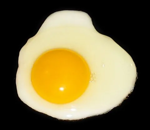 sunny side up: of an egg: fried on one side, served with the unbroken relatively soft yolk on the top