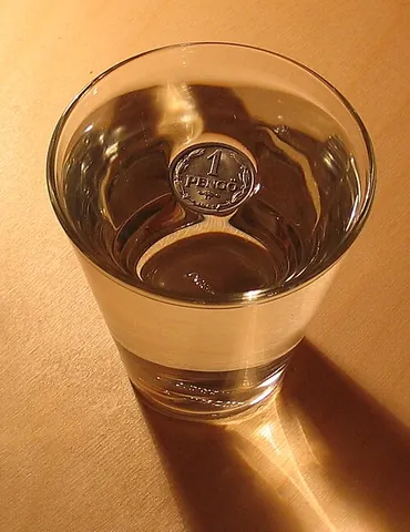 surface tension: the effect on the surface of a liquid that makes it behave as a stretched elastic membrane; it is...